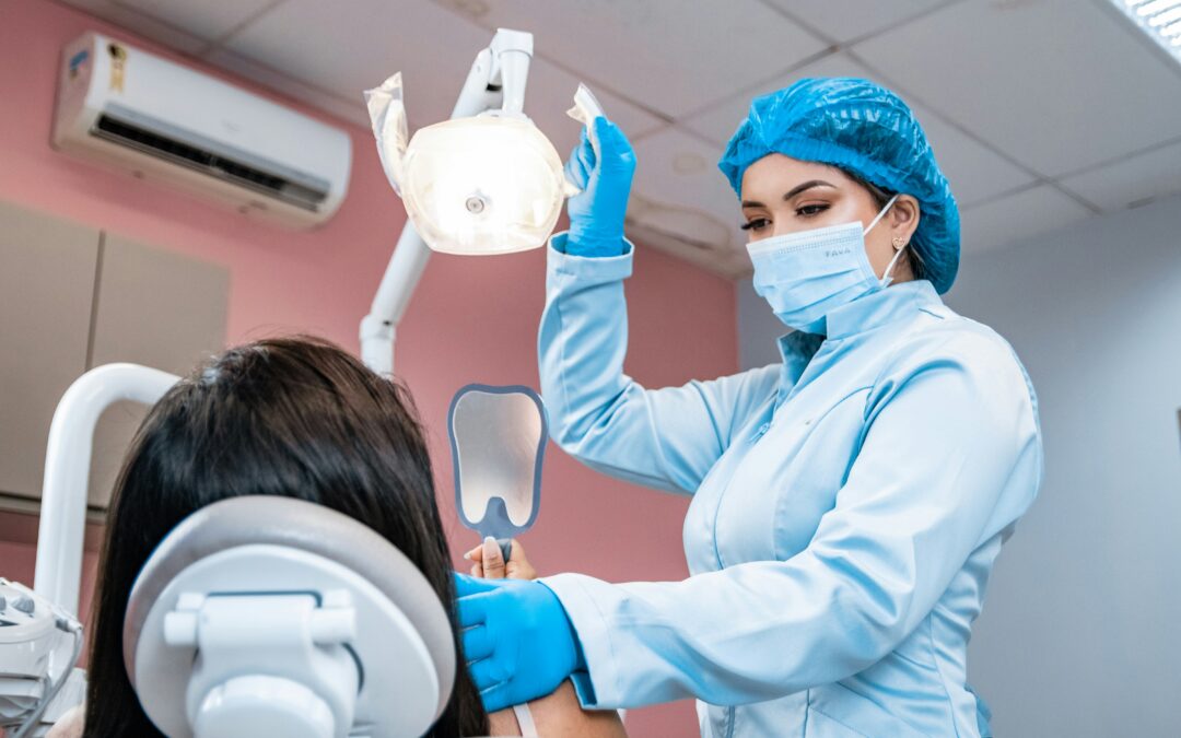 Dentist examining a patient's gums during a checkup